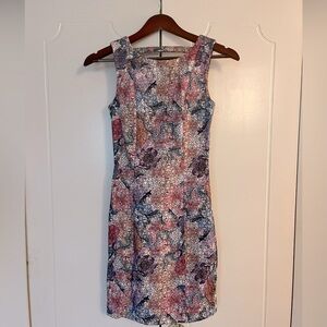 Floral mini dress with double zipper.